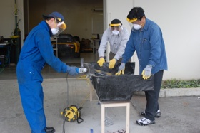 Students working on fiberglass for Porsche 944